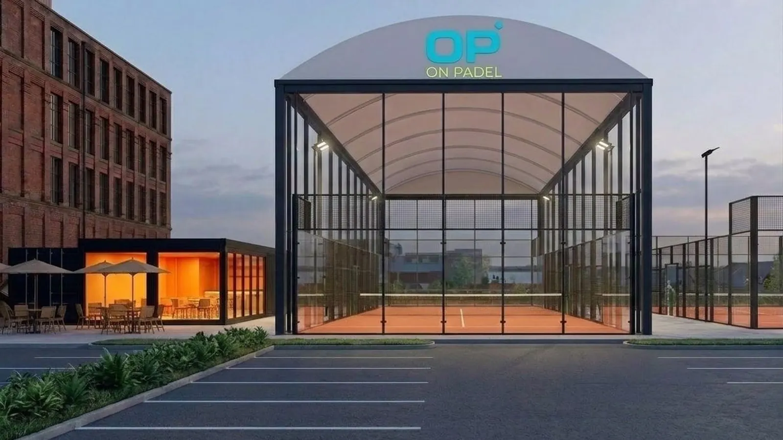 A covered padel court entrance at dusk