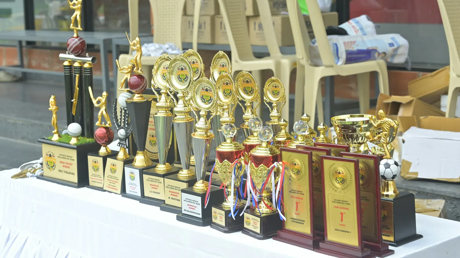 A table of trophies ready for presentation